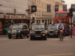 SEVERAL LONDON TAXIS ON LOWER REGENTS STREET, LONDON