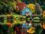 Blue house on the edge of a lake