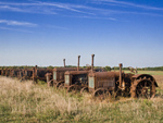 row of old tractors