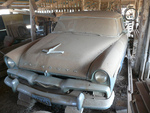 1956 plymouth savoy parked in shed