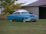 1953 oldsmobile coupe parked
