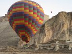 hot air balloons in the mountains