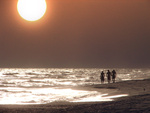 walking on the beach at sun set