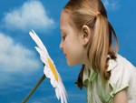 cute girl smells flower