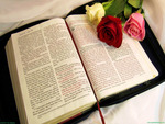 Bible with three lovely roses.