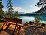 Bench-on-the-shore-of-a-mountain-lake