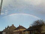 Rainbow over houses
