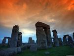 stonehenge under a fiery sky